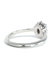 Back view of oval pink sapphire and diamond halo ring in white gold by Bena Jewelry, photographed on a white background, fine bridal jewelry made in Canada.