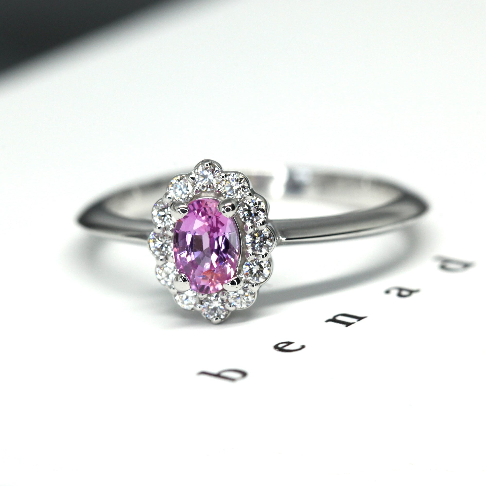 Side view of pink sapphire engagement ring montreal handmade in little italy montreal fine jewelry color gemstone custom made birdal ring pink sapphire and garnet fine gemstone ring montreal fine jeweler