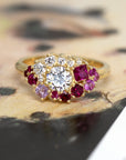 lab grown diamond and round ruby custom made engagement ring and bridal bena jewelry design montreal yellow gold statement jewels on a multi color background