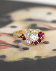 round lab grown diamond ruby yellow gold unique engagement ring custom made in montreal by the designer bena jewelry in collaboration with jeweller ruby mardi bridal jewellery on multi color background