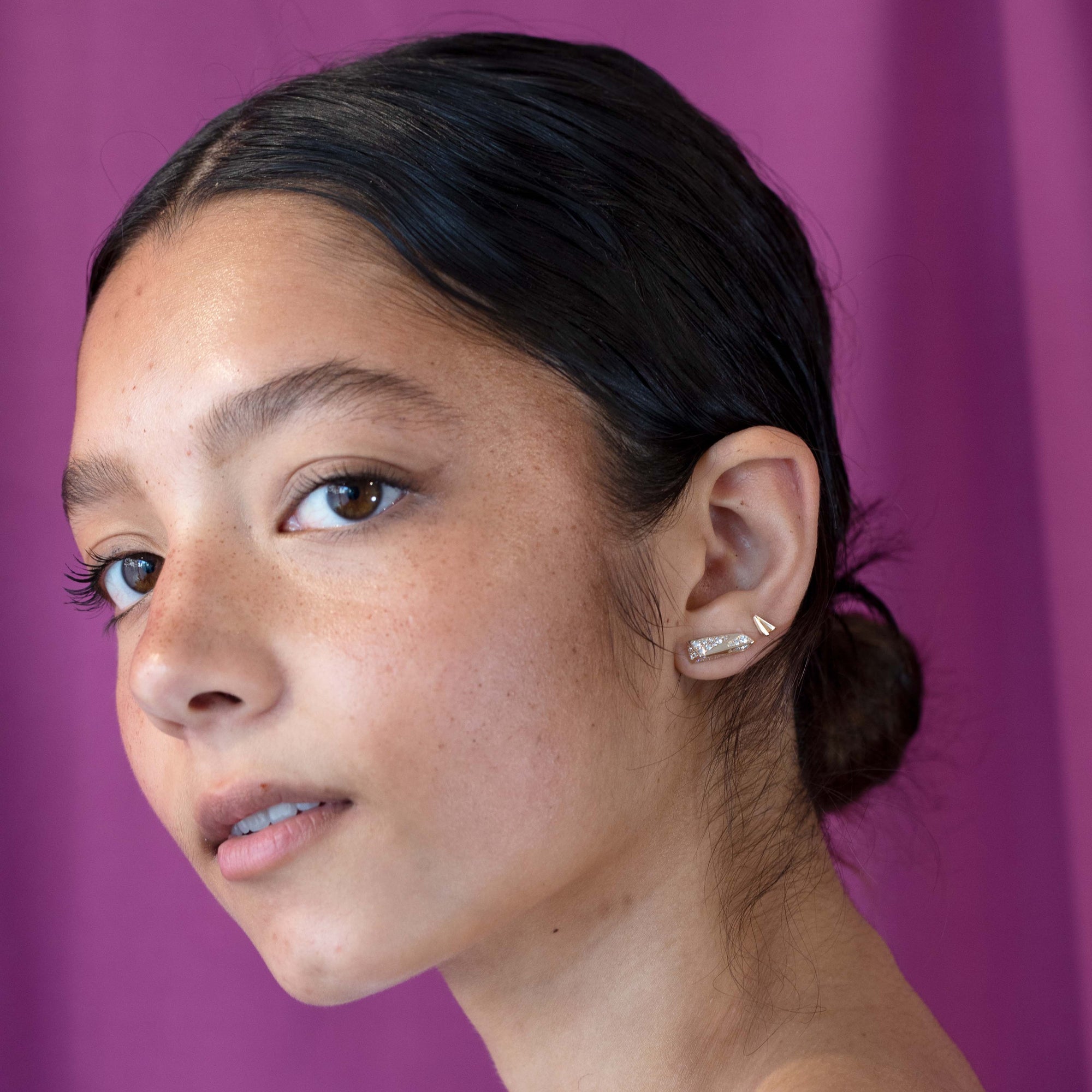 Gilr weraing Yellow gold White Diamond Edges Studs by Bena Jewelry, contemporary earrings styled with subtle elegance in Montreal.