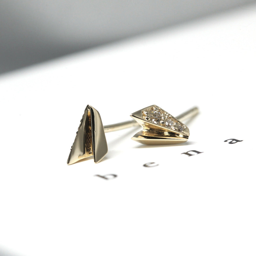 Close-up of White Diamond Edges Studs, showcasing yellow gold and sparkling white diamonds by Bena Jewelry.
