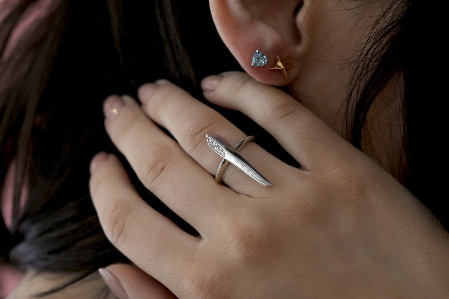 Girl wearing the straight silver ring with small round diamonds from Fancy Edgy Collection by and Small Topaze Trillion and Small Cross Shape Stud Earrings Bena Jewelry Designer Made In Montreal Canada.