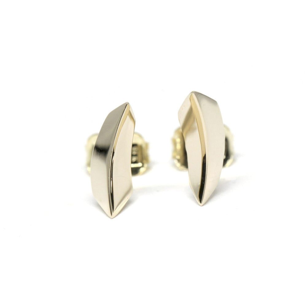Yellow gold unisex Brace Studs featuring a bold edgy center line, crafted by Bena Jewelry in Montreal.