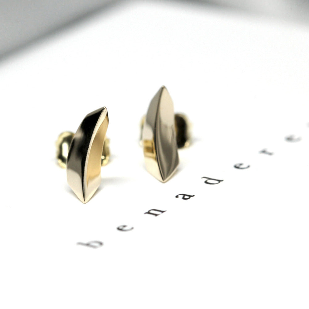 Bold and modern Brace Studs in yellow gold, crafted by Bena Jewelry, an independent designer from Montreal.