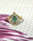 custom made pear shape emerald and white diamond halo bridal ring yellow gold bena jewelry designer montreal