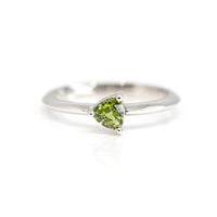trillion shape green sapphire minimalist white gold bridal made in montreal by bena jewelry on a white background