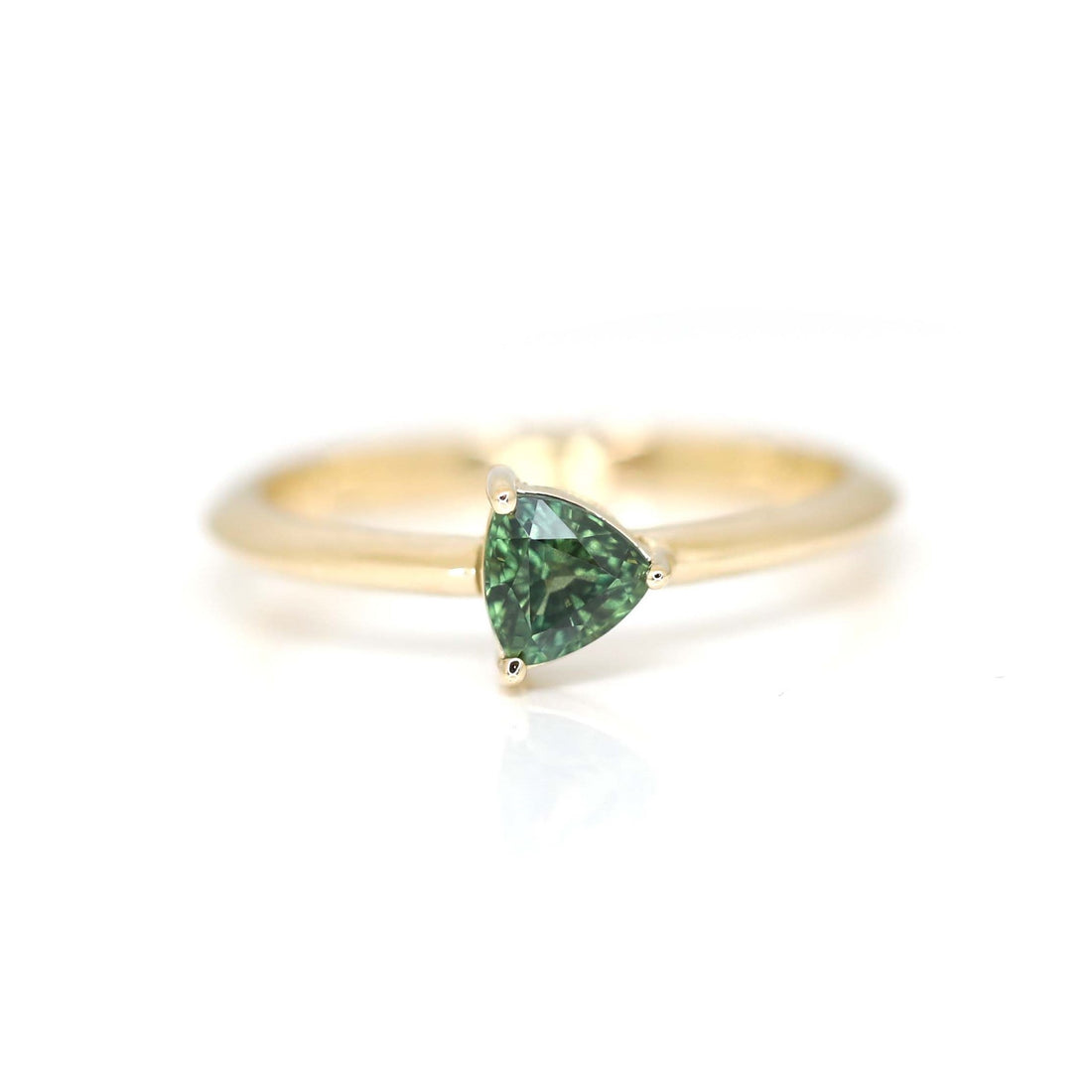 yellow gold ring with a green sapphire by designer bena jewelry from montreal