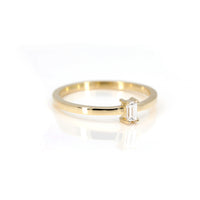side view of bena jewelry yellow gold edgy ring with baguette shape lab grown diamond made in montreal on white background