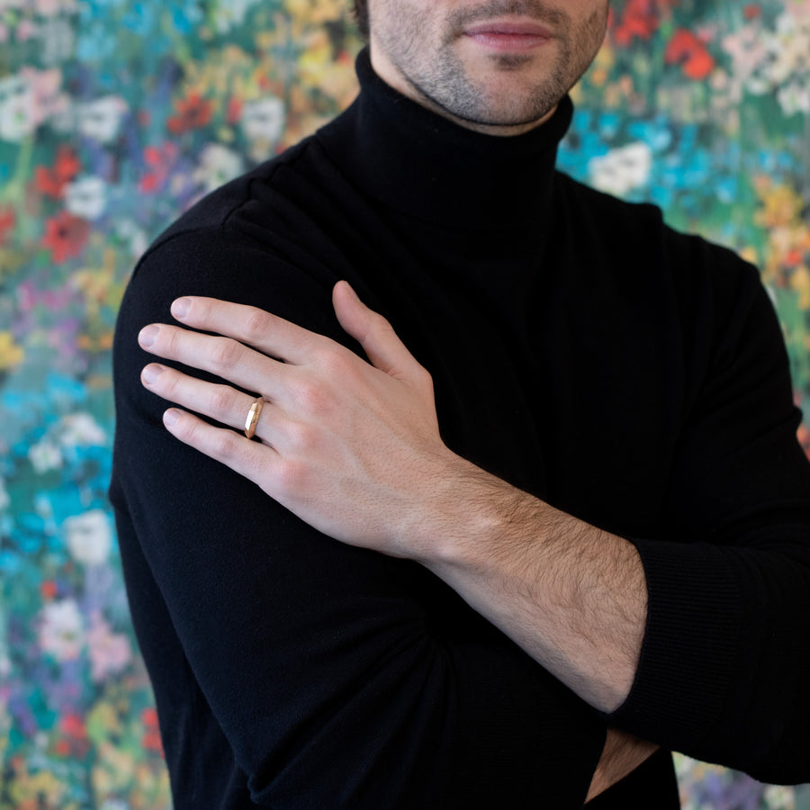men wearing a bena jewelry chiseled collection gold ring custom made in montreal at the best jeweler boutique ruby mardi on multi color background