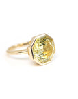 side view of custom made lemon quartz statement designer ring made by bena jewelry on a white backgroubd