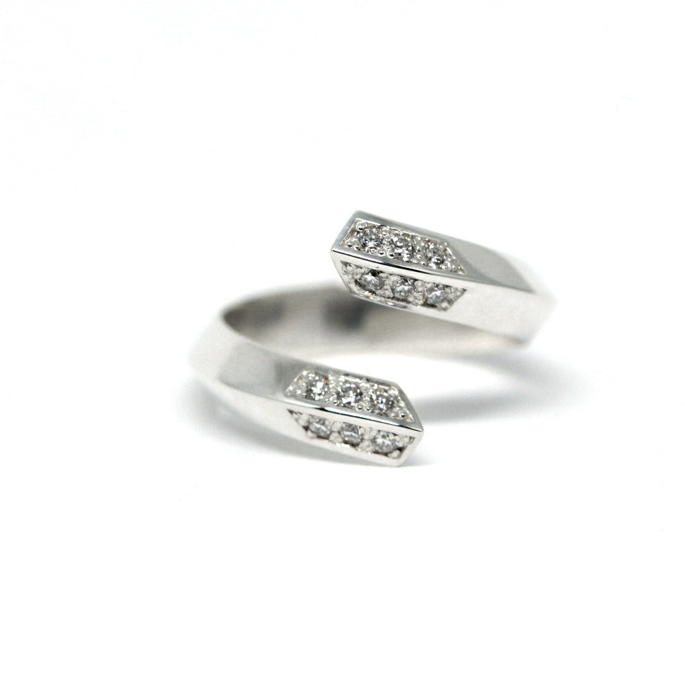 White Gold Diamond Loop Band by Bena Jewelry, featuring an open curved design with sparkling diamonds, made in Montreal.