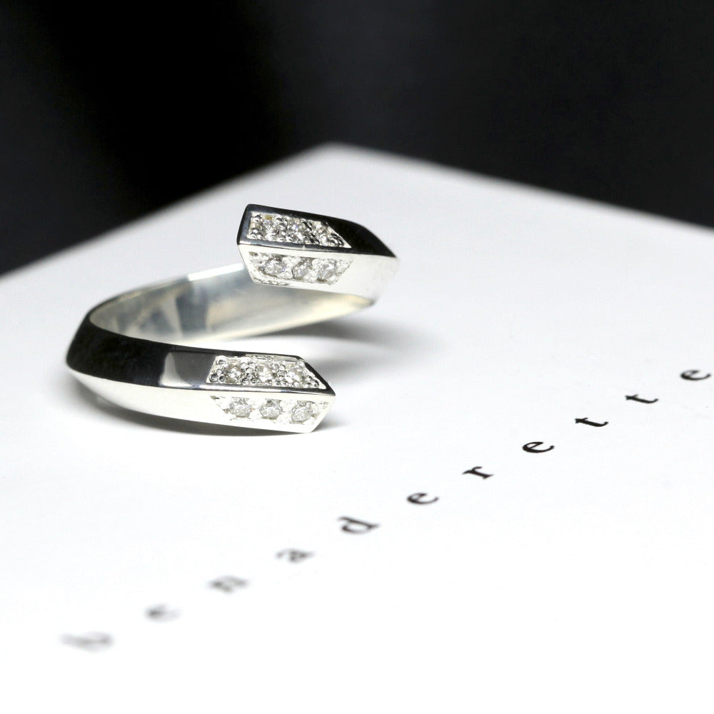 Close up of unisex white gold band with sparkling diamonds, made in Montreal by Bena Jewelry.
