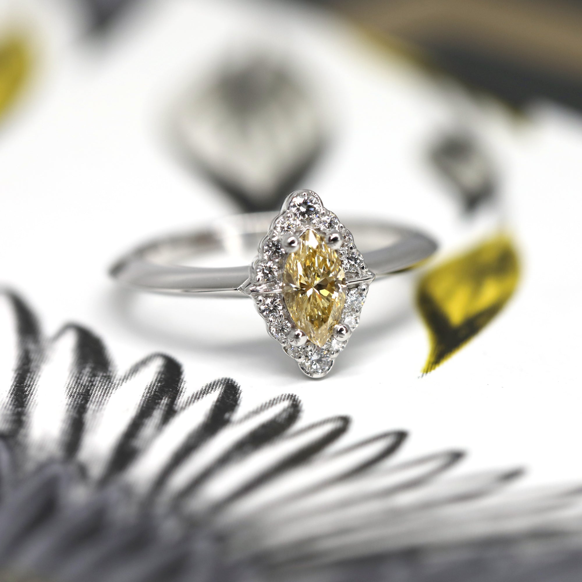 Yellow diamond marquise shape diamond ring small white round diamond custom engagement ring montreal made in canada fine jewelry bena jewelry edgy bridal ring designer color gemstone speicalist montreal made in canada fine jewelry