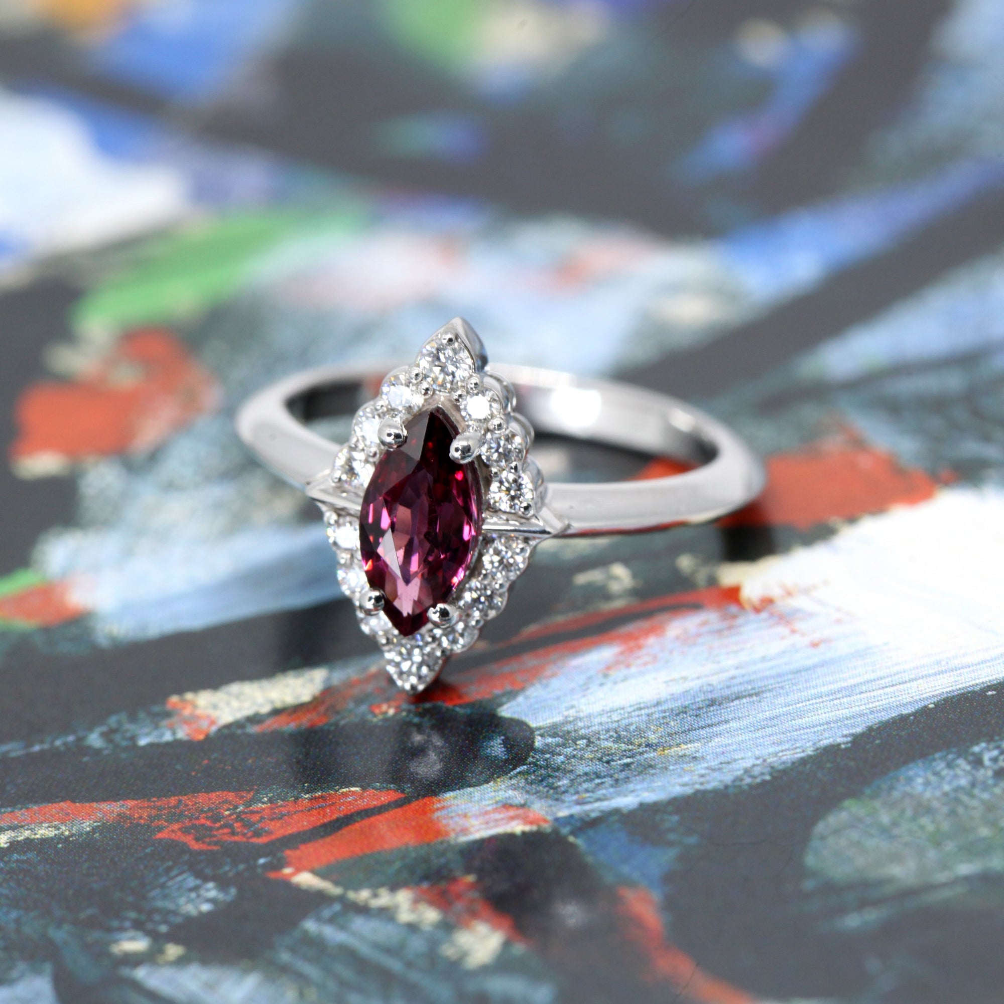 Top view of edgy marquise red gemstone ring bena jewelry montreal white gold small diamonds red natural gemstone custom made in montreal little italy jeweler handemade in montreal canada 
