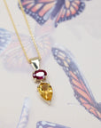 pear shape citrine and ruby gold pendant fine jewellery design montreal by bena jewelry on multi color background