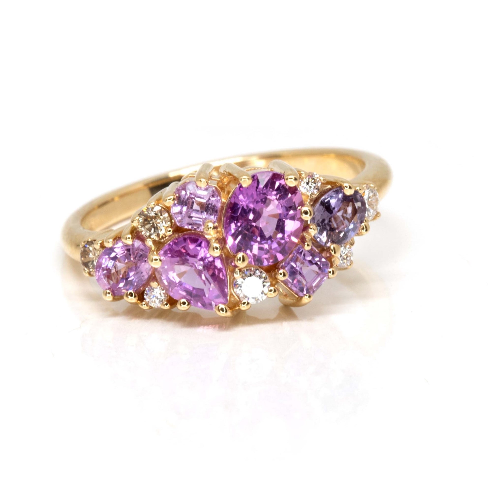 Side view: Highlights the depth and brilliance of the sapphires and diamonds, set in a sleek yellow gold band. Custom-made by Bena Jewelry, Montreal, Canada.