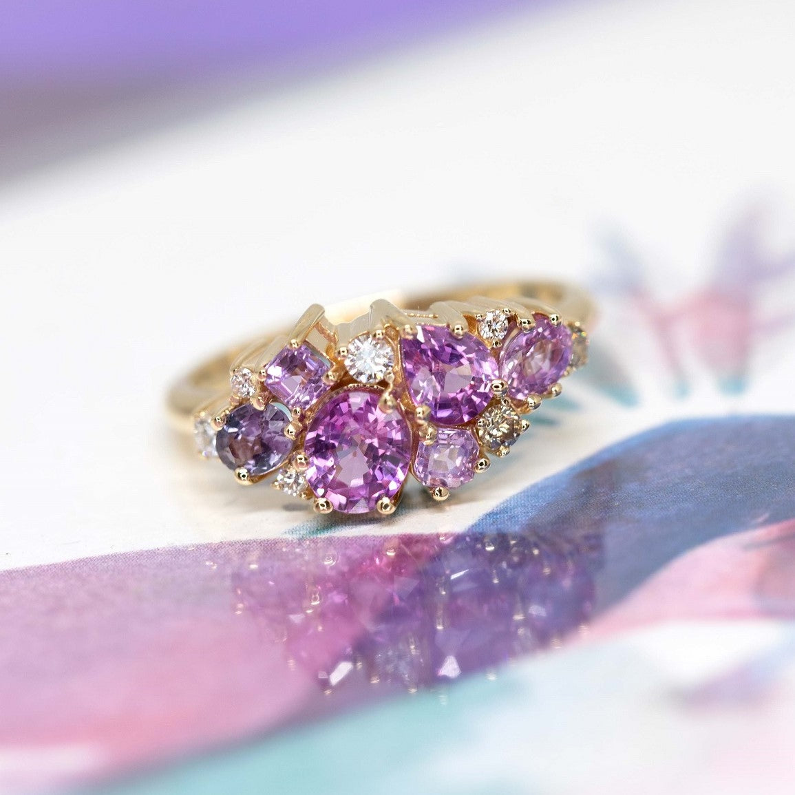 The Avalanche Pink Sapphire Ring paired with complementary pink gemstone jewelry, showcasing its elegance. Made in Montreal, Canada, by Bena Jewelry.