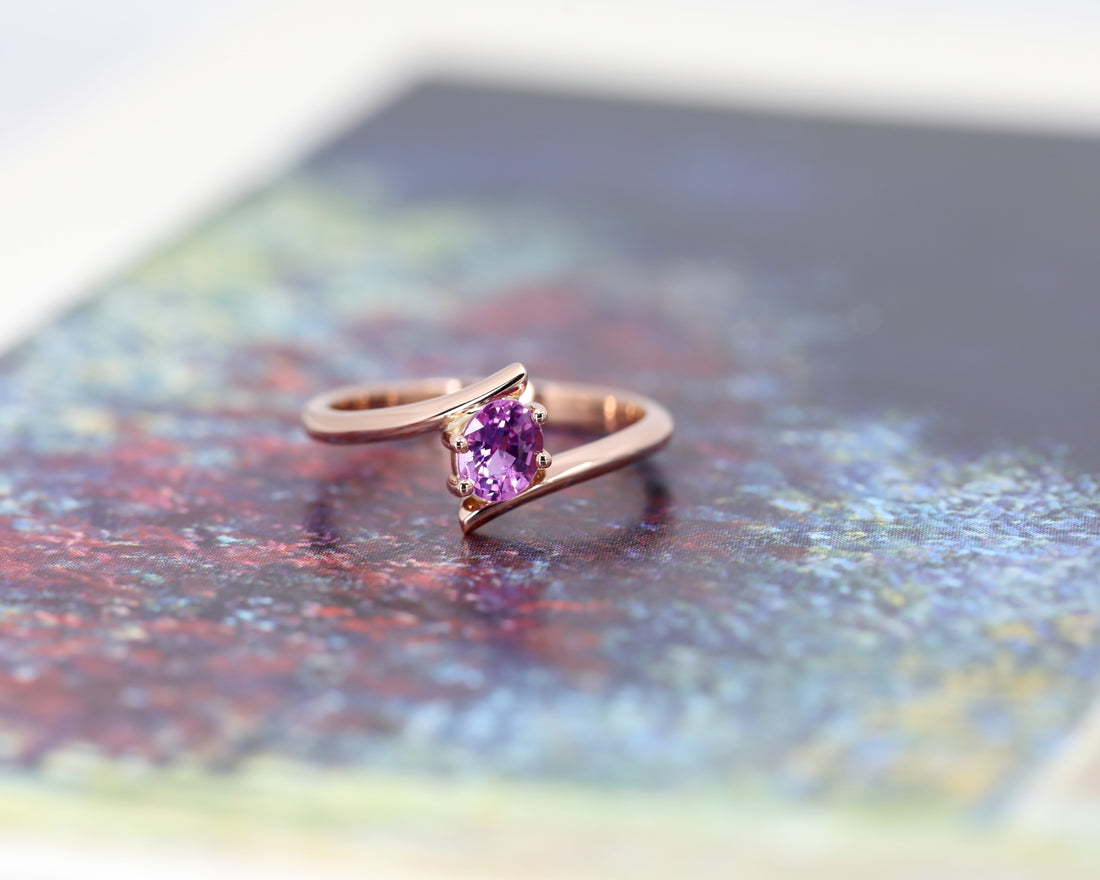 bena jewelry custom made pink sapphire minimalist engagement ring made in montreal on multi color background