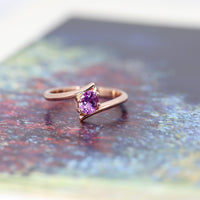bena jewelry custom made pink sapphire minimalist engagement ring made in montreal on multi color background