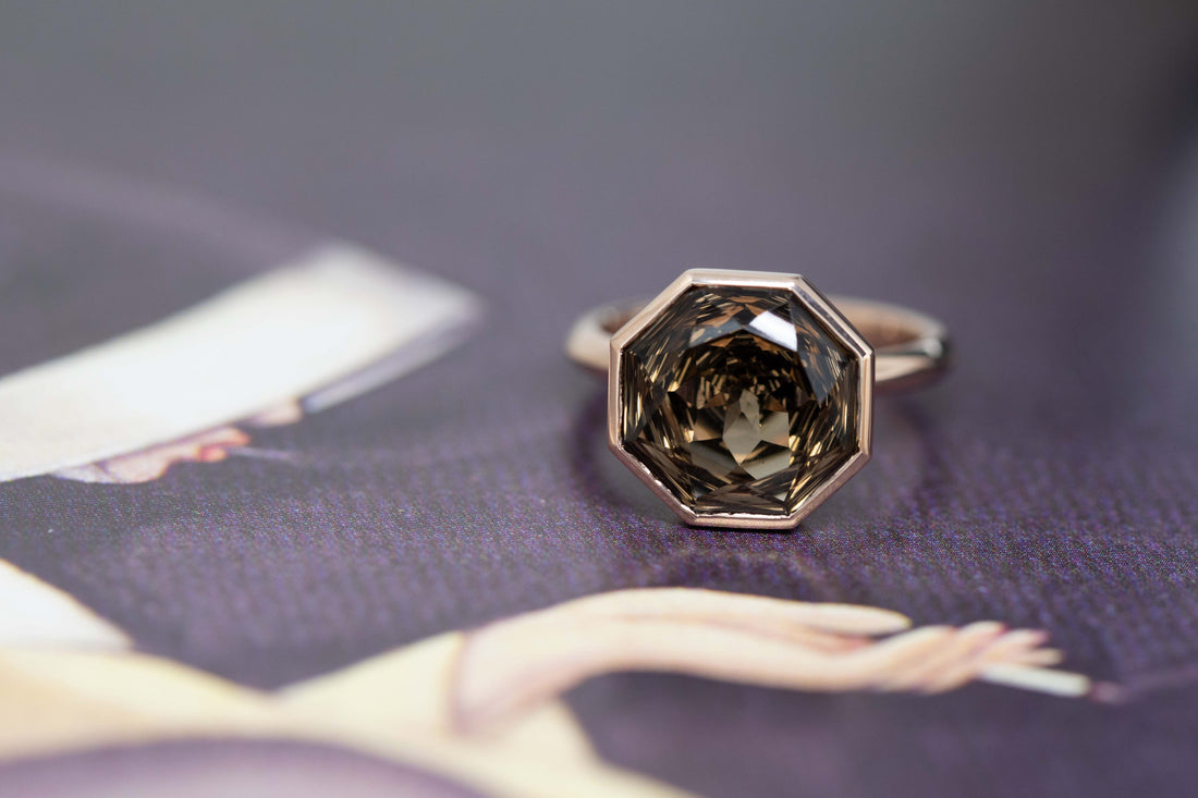 rose gold smoky quartz fancy shape ring made in montreal by bena jewelry custom made gemstone designer on a dark background