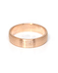 rose gold mate finish men wedding band made in montreal by bena jewelry custom bridal designer on a white background