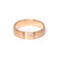 rose gold mate finish men wedding band made in montreal by bena jewelry custom bridal designer on a white background