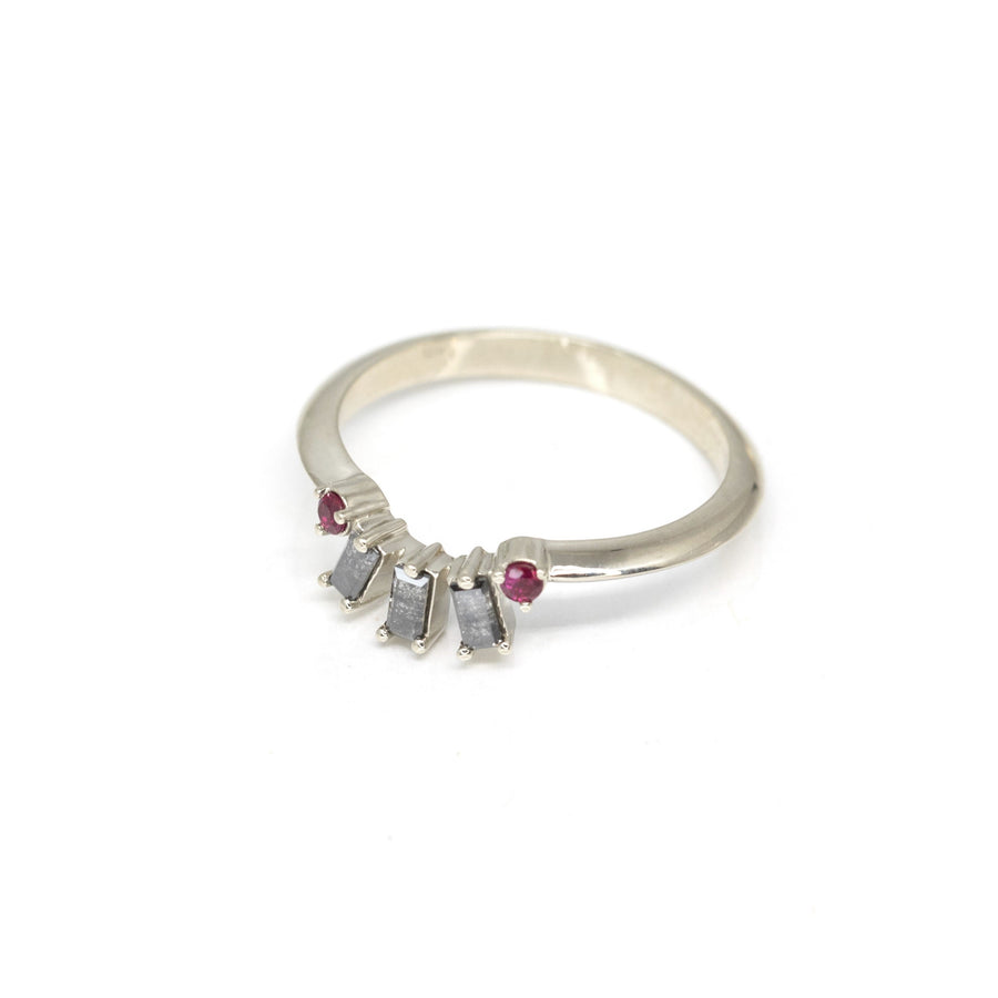 top view of white gold wedding band with salt and pepped diamond round ruby designer ring by bena jewelry on a white background