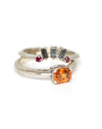 matching salt and pepper baguette diamond ring with matching orange garnet engagement white gold ring made in montreal by bena jewelry on a white background