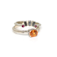 matching salt and pepper baguette diamond ring with matching orange garnet engagement white gold ring made in montreal by bena jewelry on a white background