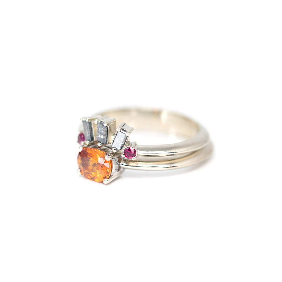 matching garnet engagement ring and matching salt and pepper wedding band custom white gold bena jewelry in montreal on a white background