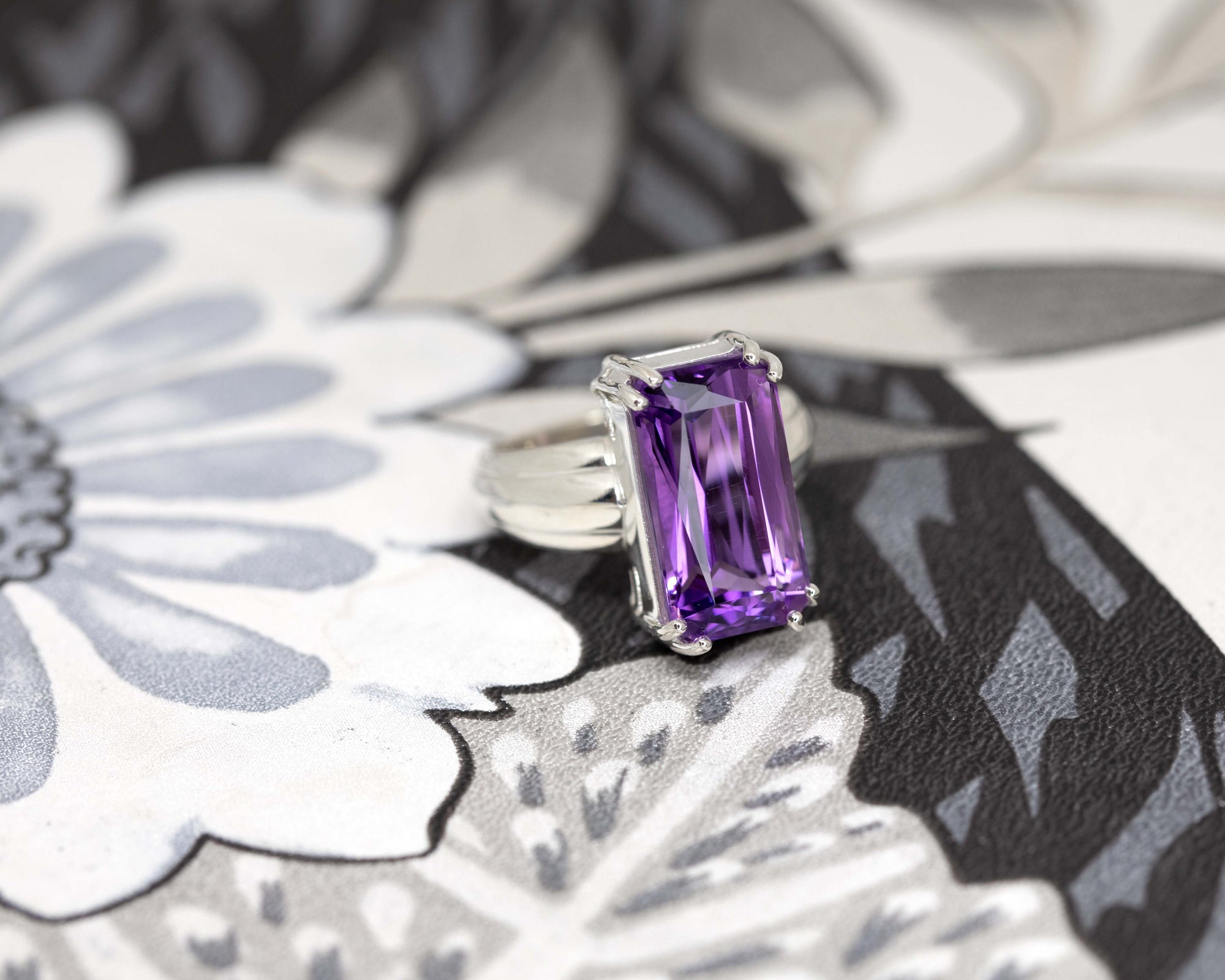 Amethyst Ring on soft-toned background – The rich violet hues of the gemstone contrast beautifully against the neutral background, enhancing its bold presence.