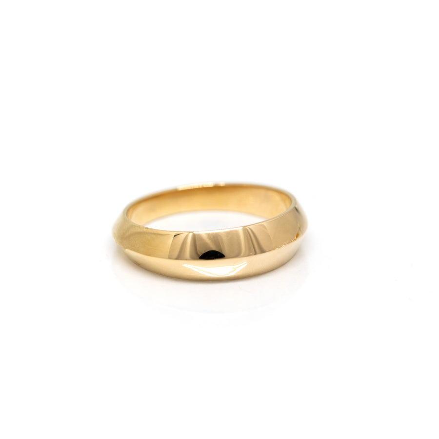side view of yellow gold domed wedding band for man made by bena jewelry designer in montreal on a white background