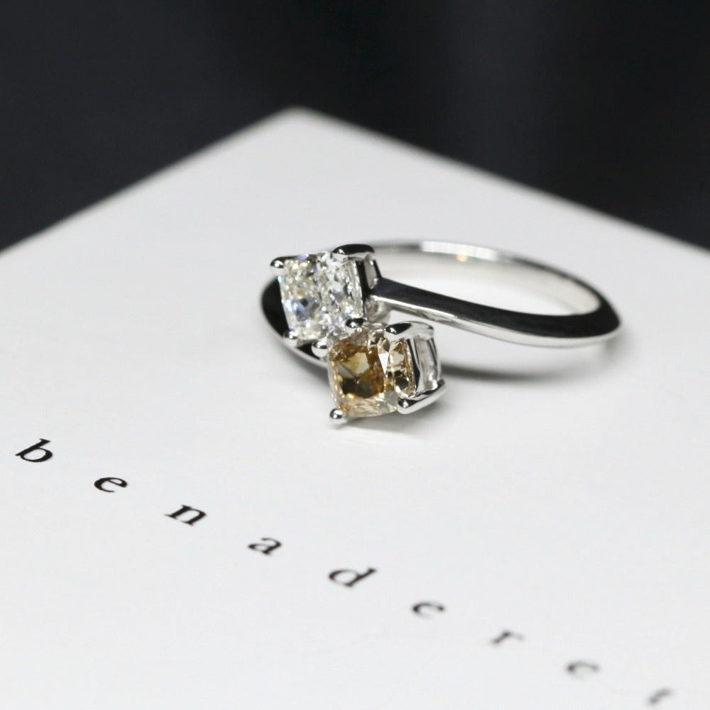  Top-down view of double diamond ring – Cushion-cut diamonds set in white gold for a sophisticated and meaningful design.