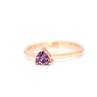 side view of a rose gold ring with a trillion shaped pink purple stone on a white background, this finacailles ring is custom made in montreal