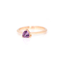 trillion shape purple sapphire rose gold ring on a white background