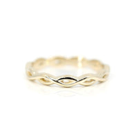 front view twist style yellow gold custom made wedding band montreal by designer bena jewelry best canadian bridal ring on white background