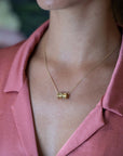 girl wearing vermiel gold edgy pendant made by bena jewelry designer montreal