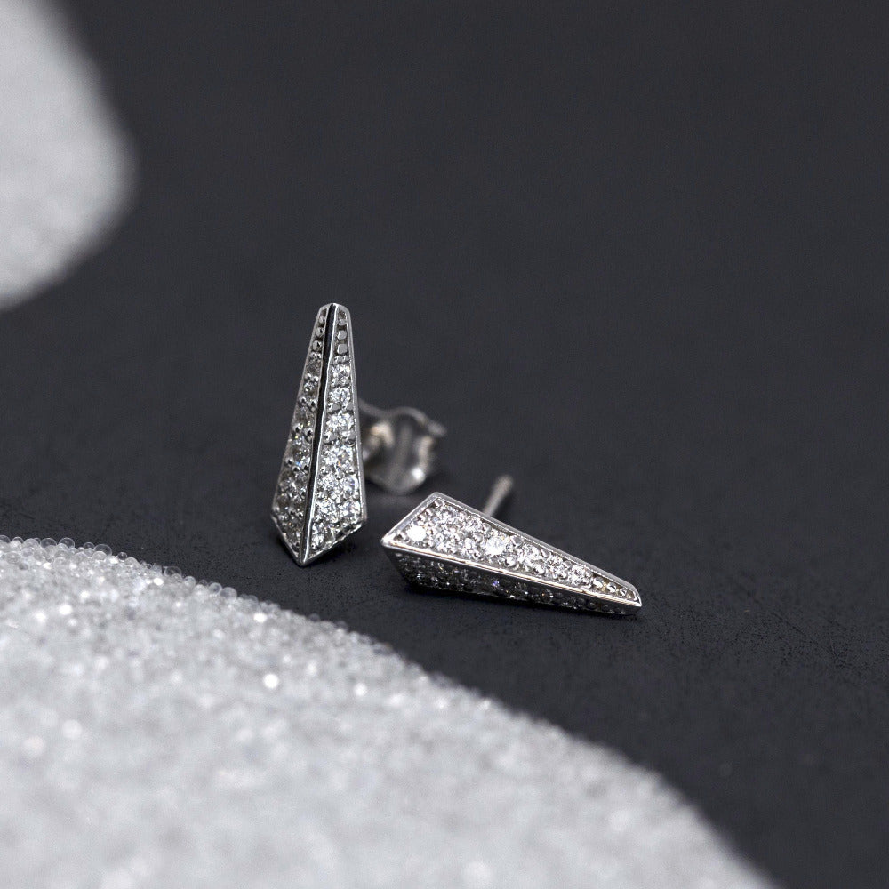 Diamond Blade Earrings in white gold, featuring sparkling diamonds, photographed on a dark gray background, crafted by Bena Jewelry.
