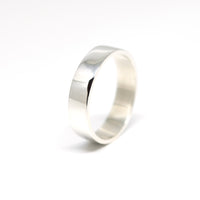 front view of white gold men wedding band flat style and bright finish custom made bridal bena jewelry montreal on white background
