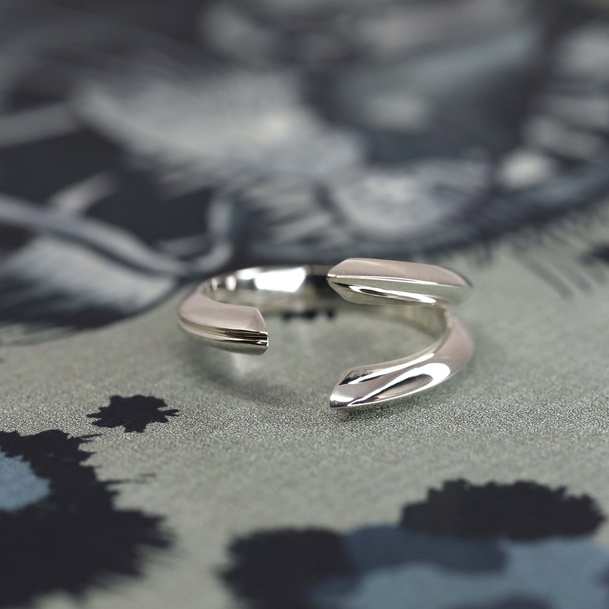 Angled shot of Fang Ring in White Gold – A striking and unique unisex ring, blending minimalism with edgy, modern design.