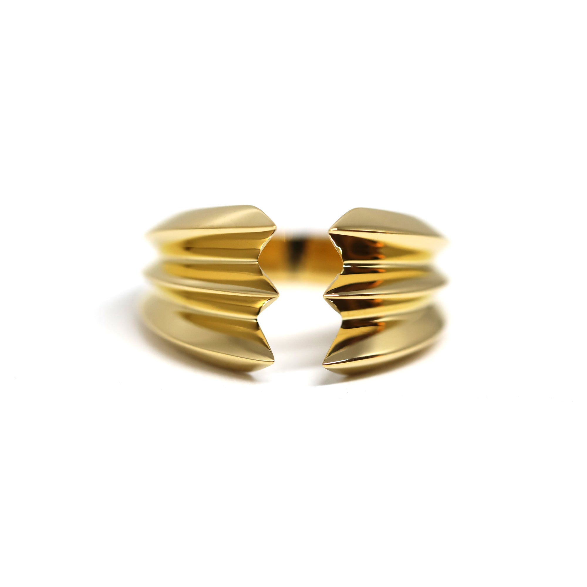 Crush Ring in gold on white background – A bold unisex statement ring with sharp, layered edges, crafted by Bena Jewelry in Montreal.