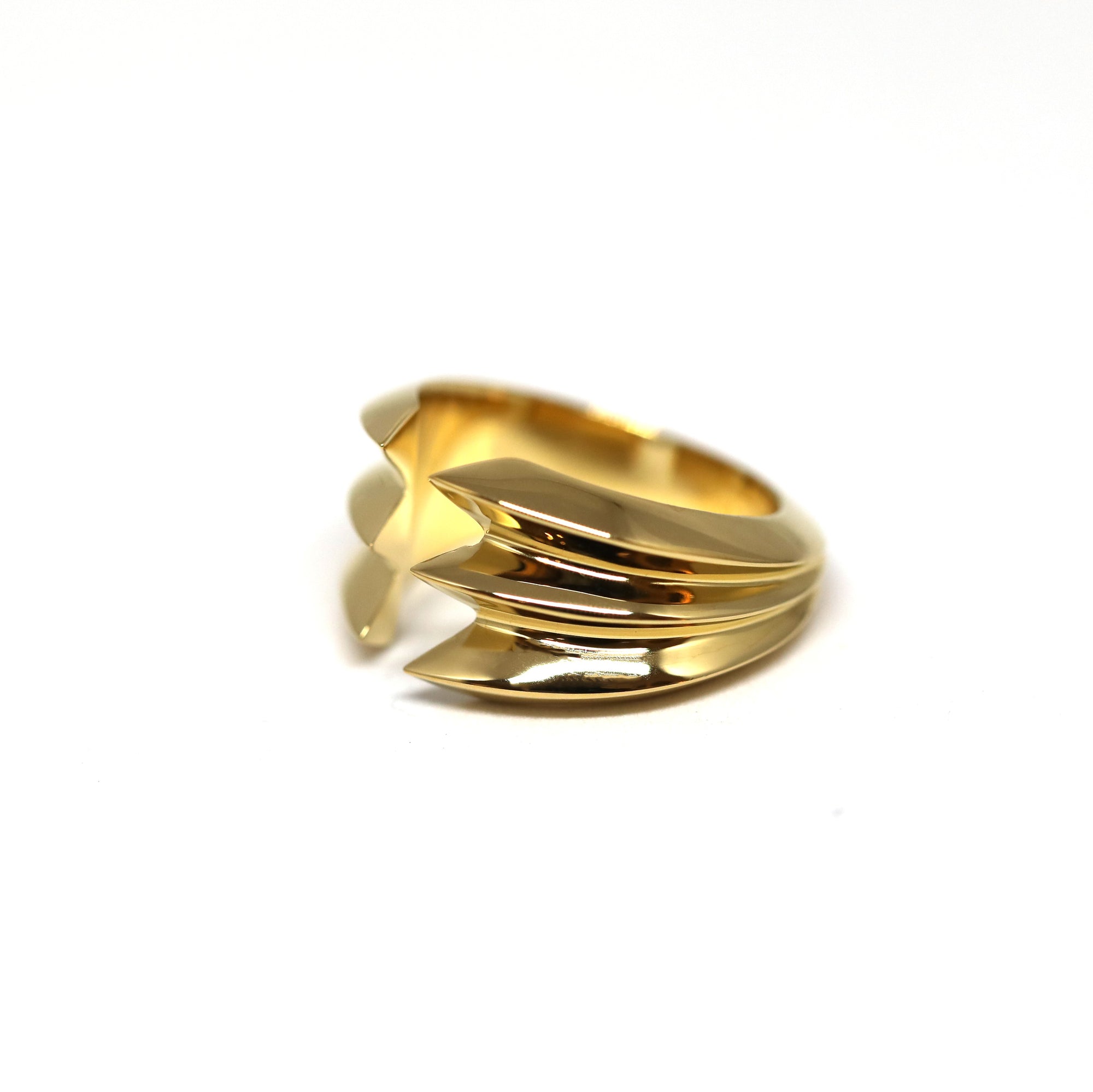  Close-up of Crush Ring – A sculptural gold ring with a modern, architectural silhouette for a striking look.