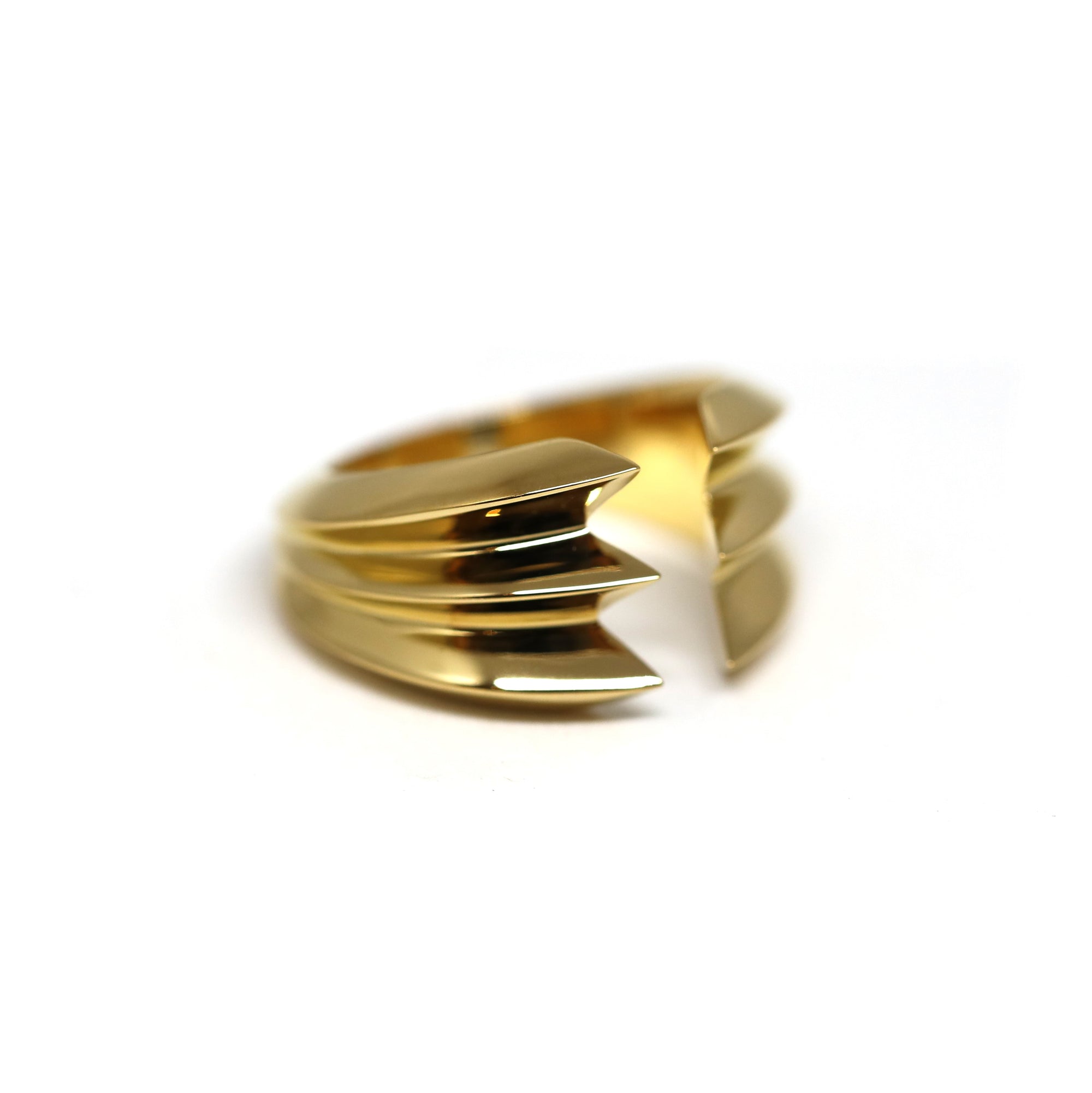 Side view of Crush Ring in Yellow Gold – A striking fine jewelry piece with an avant-garde, open-ended structure and polished finish.