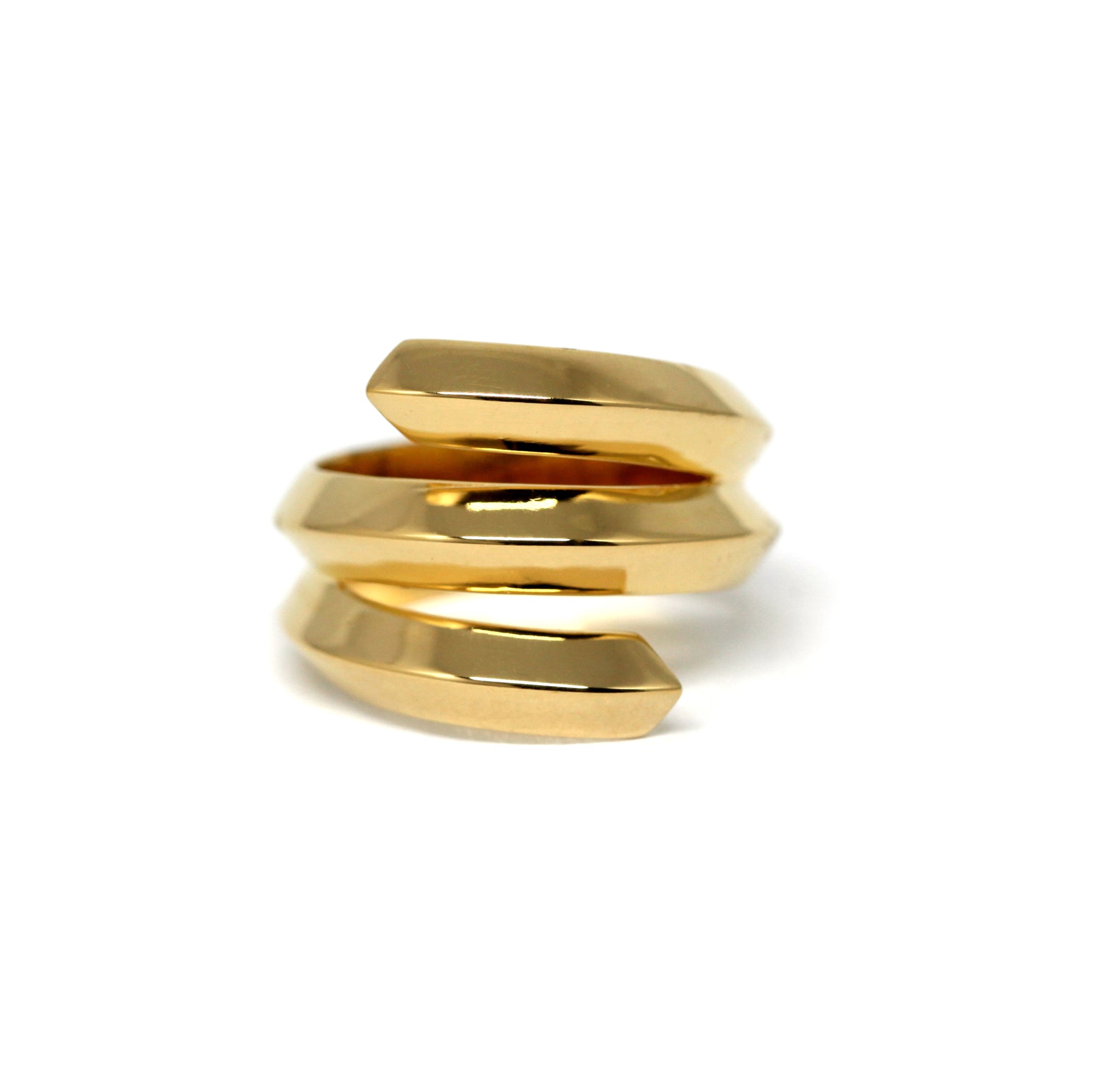 Embrace Ring in yellow gold background – A bold and sculptural unisex gold ring with an edgy, layered design, handcrafted by Bena Jewelry in Montreal.