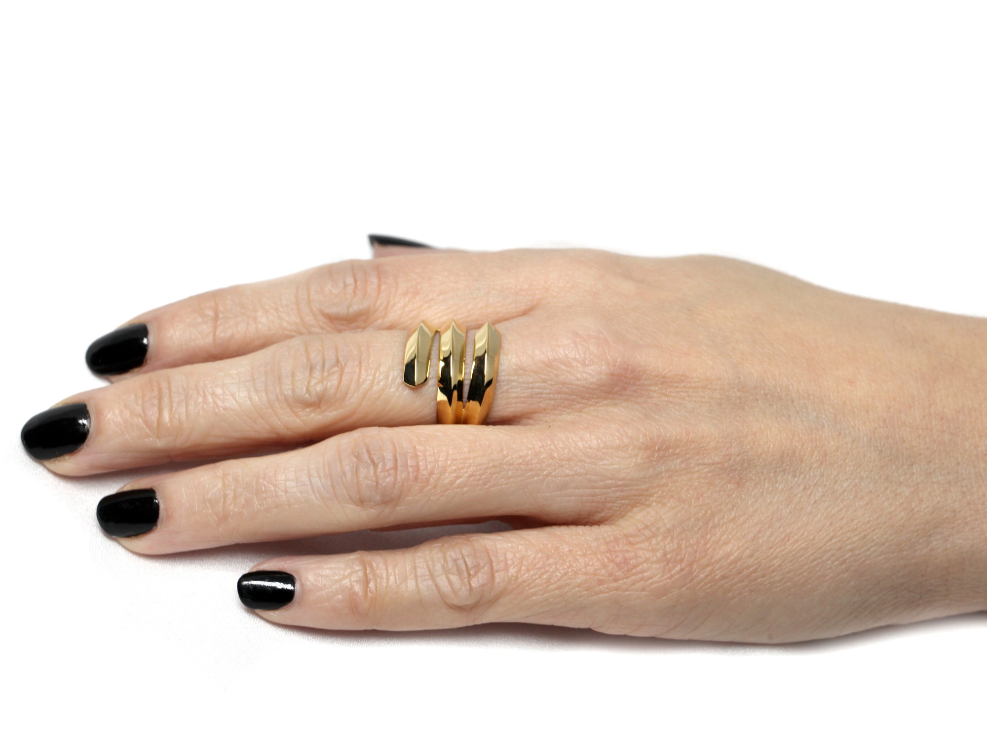  Angled shot of Embrace Ring in Yellow Gold – A sleek, stacked gold ring with a distinctive, layered silhouette.
