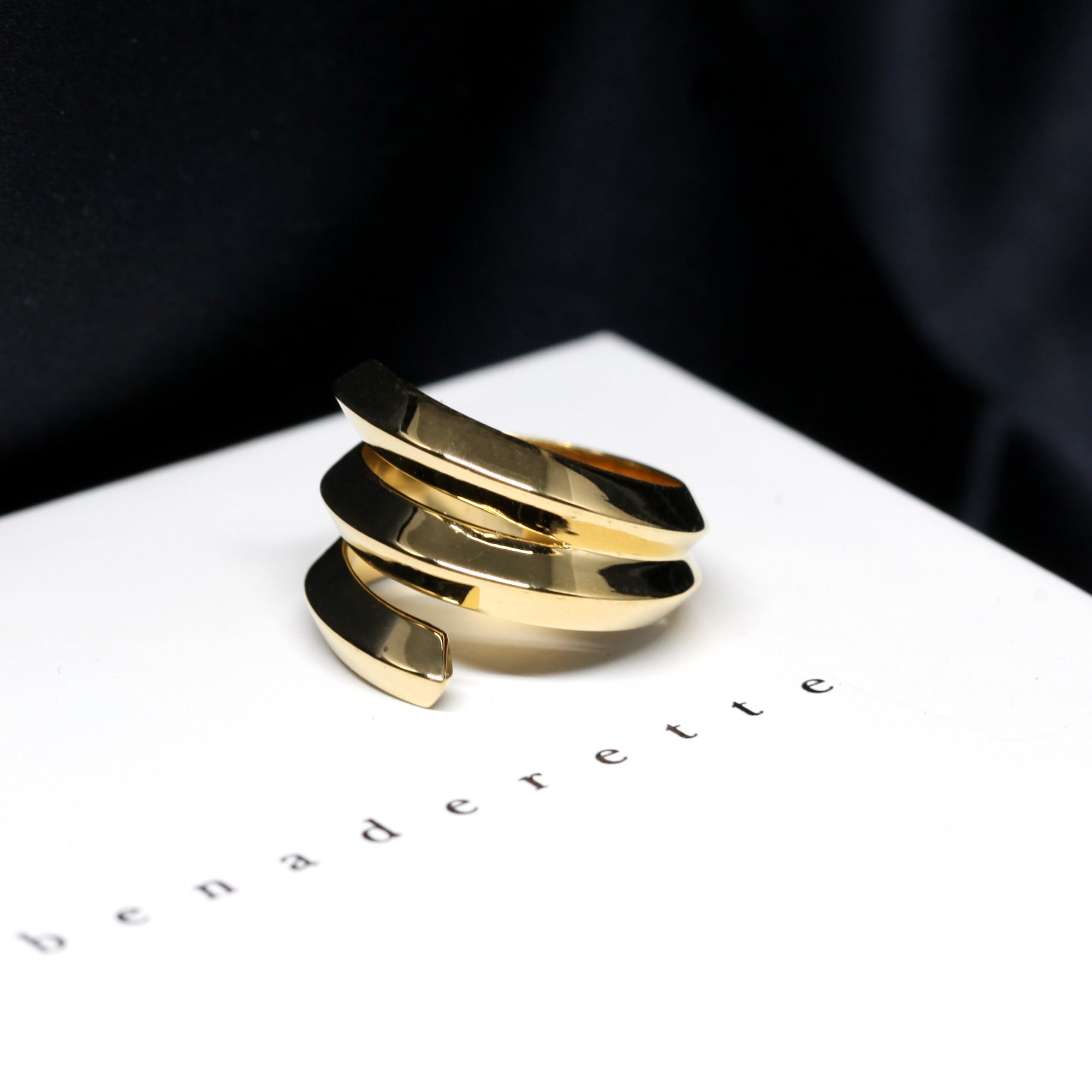 Side view of Embrace Ring in Yellow Gold – A contemporary and modern unisex ring with an open, sculptural design.
