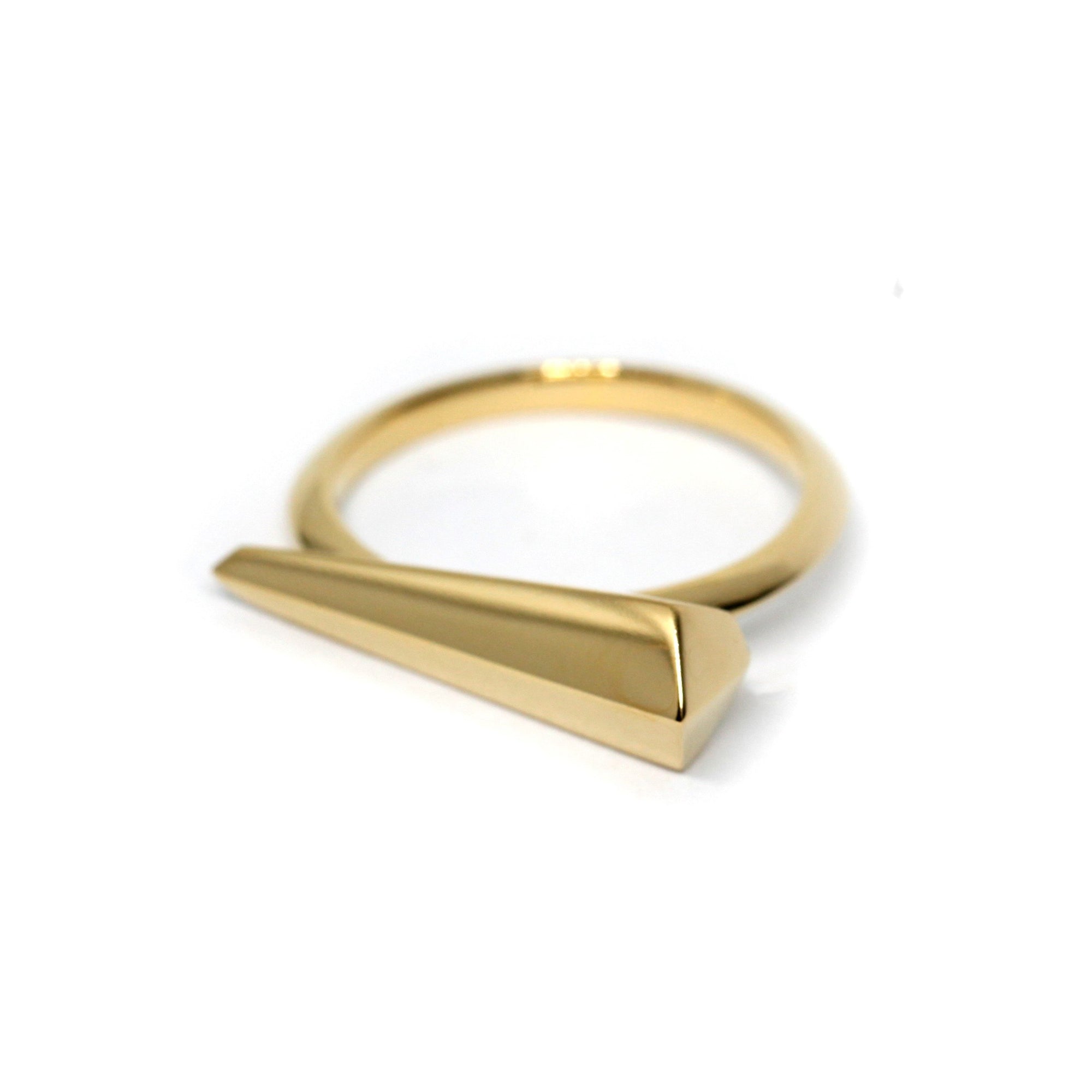 Spine Ring in Yellow Gold on white background – A sleek and sculptural unisex gold ring with a sharp, elongated design, handcrafted by Bena Jewelry in Montreal.